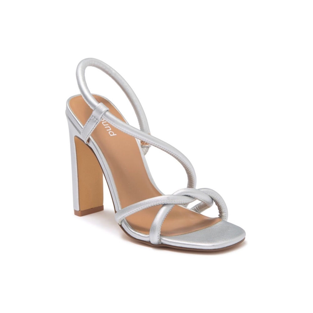 A sinuous strap twists across slingback sandal with a slender squared heel.